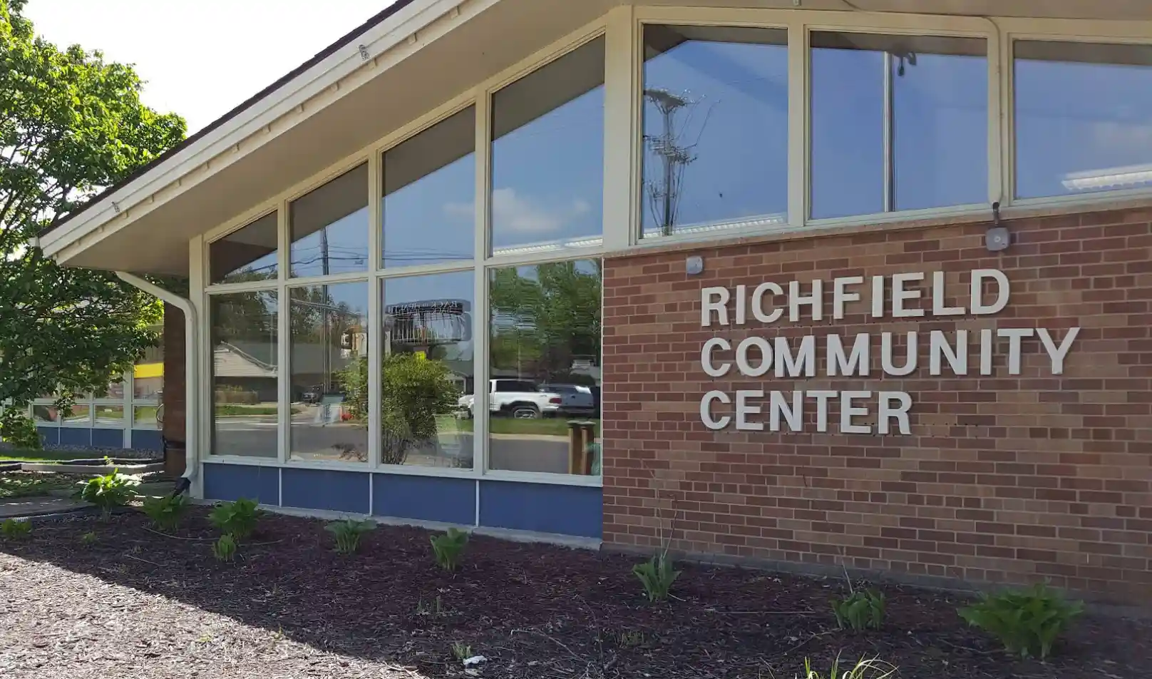 Exterior of the Richfield Community Center with large windows and brick facade