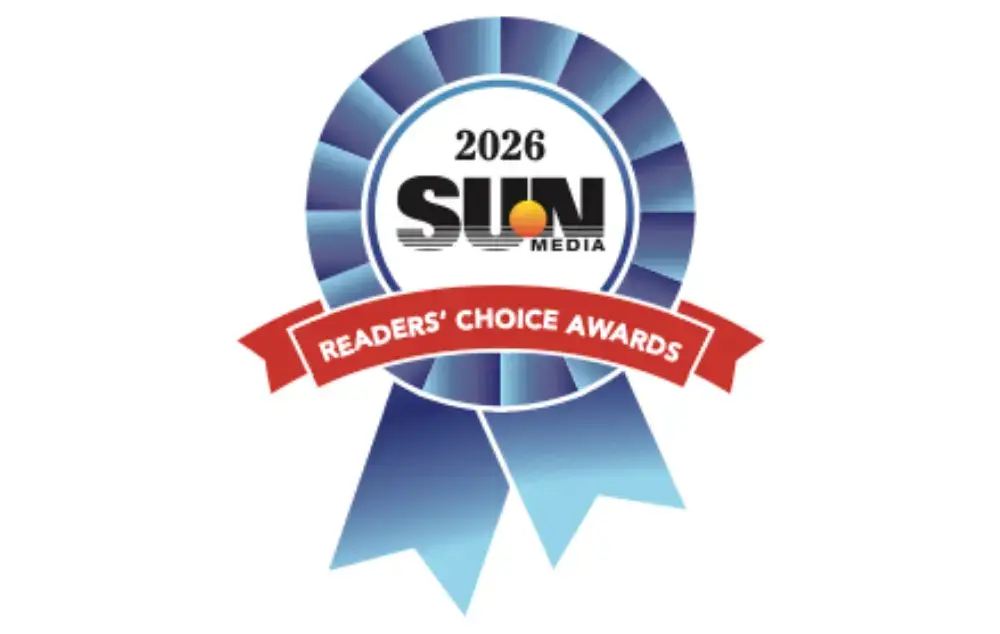 Blue ribbon graphic for the Sun Media 2026 Readers’ Choice Awards with red banner and circular SUN logo in the center.